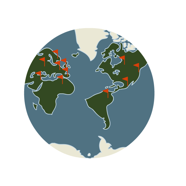 globe with flags placed on different locations scattered throughout the world